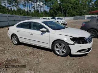 2014 Volkswagen CC Sport with VIN WVWBP7AN8EE538737, listed as a Copart auction lot 68656344 with 131,941 mi miles and Salvage Title. Bid and sale history available at carsss.com. Image 4.