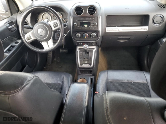 2016 Jeep Compass Latitude with VIN 1C4NJDEB8GD757624, listed as a Copart auction lot 84997714 with 140,906 mi miles and Salvage Title. Bid and sale history available at carsss.com. Image 8.