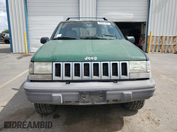 1993 Jeep Grand Cherokee Laredo with VIN 1J4GZ58Y8PC513026, listed as a Copart auction lot 57001465 with 135,242 mi miles and Clean title. Bid and sale history available at DreamBid. Image 5.