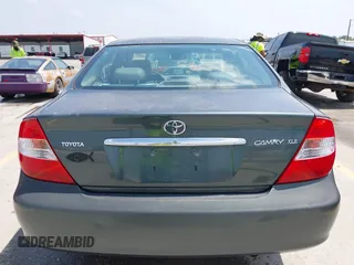 2002 Toyota Camry LE z VIN 4T1BE30KX2U591037, wystawiony jako IAAI lot #42077641 z przebiegiem 86 569 mil mil oraz . Historia ofert i sprzedaży dostępna na DreamBid. Obrazek 16.