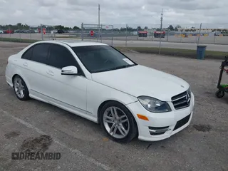 2014 Mercedes-Benz C C 250 Sport with VIN WDDGF4HBXEA941179, listed as a IAAI auction lot 42015129 with 76,684 mi miles. Bid and sale history available at carsss.com. Image 1.