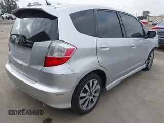 2013 Honda Fit Sport with VIN JHMGE8H58DC003021, listed as a IAAI auction lot 42120318 with 233,056 mi miles. Bid and sale history available at carsss.com. Image 4.