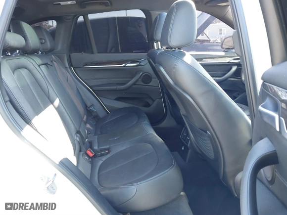 2016 BMW X1 xDrive28i with VIN WBXHT3C32G5E51855, listed as a IAAI auction lot 41634237 with 69,101 mi miles. Bid and sale history available at carsss.com. Image 8.