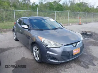 2013 Hyundai Veloster w/Black Int with VIN KMHTC6AD6DU169765, listed as a IAAI auction lot 41928516 with 130,708 mi miles and . Bid and sale history available at DreamBid. Image 1.