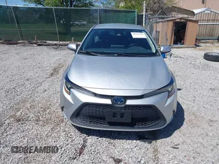 2021 Toyota Corolla Hybrid LE with VIN JTDEAMDE5MJ022110, listed as a IAAI auction lot 41912920 with 59,198 mi miles. Bid and sale history available at carsss.com. Image 12.