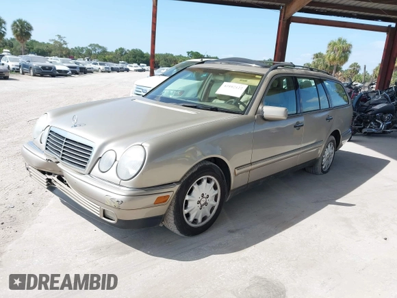 1999 Mercedes-Benz E-Class with VIN WDBJH65F3XA845635, listed as a IAAI auction lot 42102122 with 215,678 mi miles. Bid and sale history available at carsss.com. Image 2.