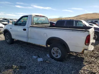 1999 Ford F-150 z VIN 1FTRF18W1XKA87801, wystawiony jako Copart lot #79094454 z przebiegiem Nie podano mil oraz Szkoda całkowita • Salvage title. Historia ofert i sprzedaży dostępna na DreamBid. Obrazek 2.
