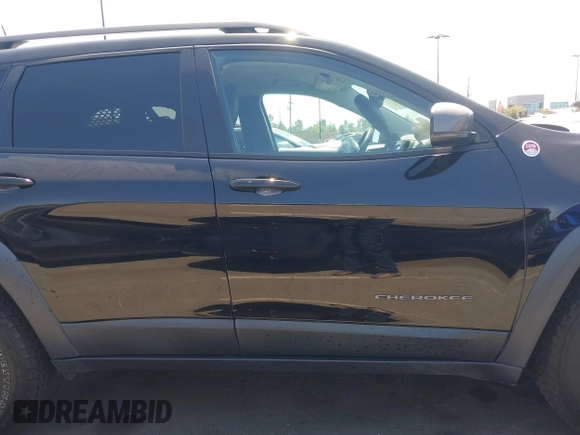 2019 Jeep Cherokee Trailhawk with VIN 1C4PJMBXXKD433284, listed as a IAAI auction lot 42020051 with 57,089 mi miles and . Bid and sale history available at DreamBid. Image 14.