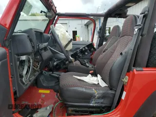 2000 Jeep Wrangler SE with VIN 1J4FA29P6YP793045, listed as a Copart auction lot 58756715 with 202,110 mi miles and Salvage title. Bid and sale history available at DreamBid. Image 7.