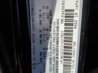 2005 Mazda 3 s with VIN JM1BK323151227825, listed as a Copart auction lot 48752855 with 142,316 mi miles and Salvage Title. Bid and sale history available at carsss.com. Image 12.