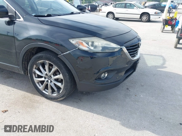 2015 Mazda CX-9 Grand Touring z VIN JM3TB2DA1F0456773, wystawiony jako IAAI lot #42257555 z przebiegiem 152 890 mil mil oraz . Historia ofert i sprzedaży dostępna na DreamBid. Obrazek 6.