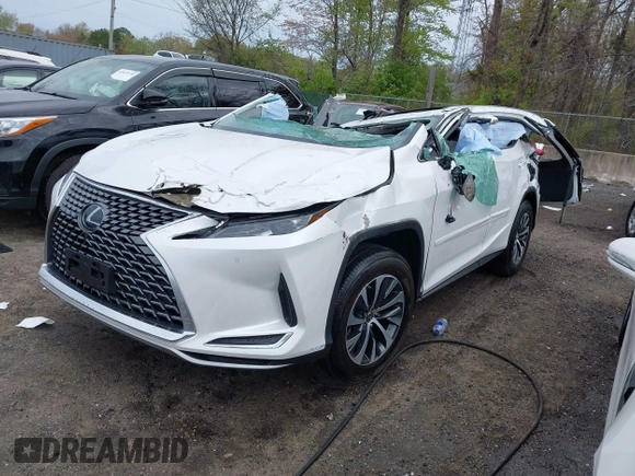 2021 Lexus RX with VIN 2T2HZMDA3MC282824, listed as a IAAI auction lot 42019255 with 1 mi miles. Bid and sale history available at carsss.com. Image 2.