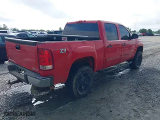 2010 GMC Sierra 1500 SLE with VIN 3GTRKVE33AG214902, listed as a IAAI auction lot 41941809 with 294,740 mi miles. Bid and sale history available at carsss.com. Image 4.