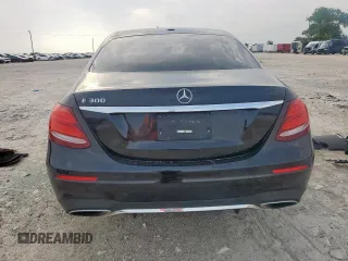 2019 Mercedes-Benz E 300 with VIN WDDZF4JB2KA618999, listed as a Copart auction lot 56915465 with 64,077 mi miles and Salvage title. Bid and sale history available at DreamBid. Image 6.