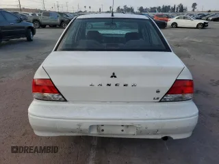 2002 Mitsubishi Lancer LS with VIN JA3AJ36E02U064779, listed as a Copart auction lot 86749184 with 127,343 mi miles and Salvage Title. Bid and sale history available at carsss.com. Image 6.