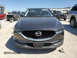 2017 Mazda CX-5 Touring with VIN JM3KFACL1H0100436, listed as a Copart auction lot 53058875 with 77,205 mi miles and Salvage Title. Bid and sale history available at DreamBid. Image 5.