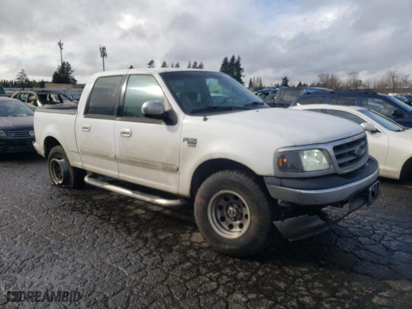 2002 Ford F-150 XLT with VIN 1FTRW07L12KA32310, listed as a Copart auction lot 44012485 with 200,586 mi miles and Salvage Title. Bid and sale history available at carsss.com. Image 4.