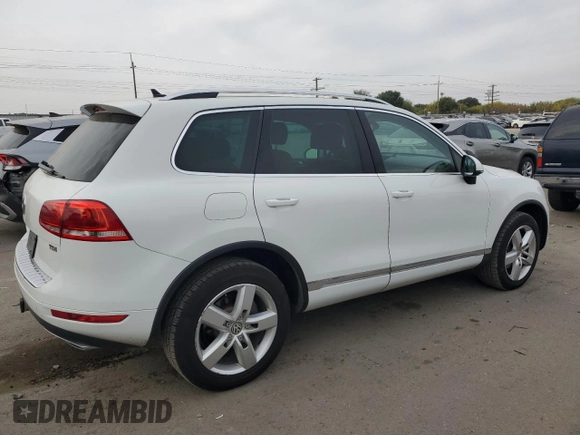 2013 Volkswagen Touareg Sport с VIN WVGEP9BP9DD003974, выставлен на аукционе Copart как лот 75106234 с пробегом 211 323 миль миль и Чистый • Clean title. История ставок и продаж доступна на DreamBid. Изображение 3.