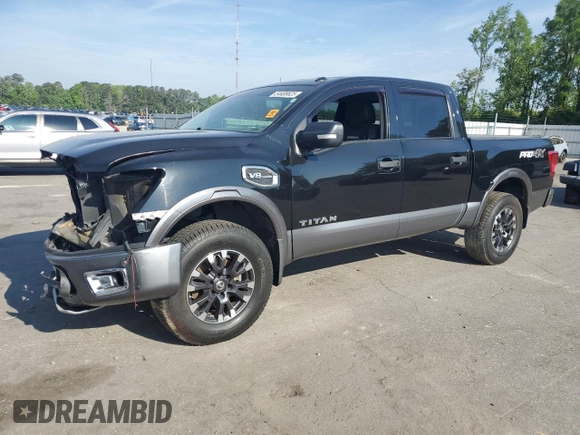 2017 Nissan Titan Platinum Reserve with VIN 1N6AA1E53HN569660, listed as a Copart auction lot 54409625 with 98,858 mi miles and Salvage title. Bid and sale history available at DreamBid. Image 1.