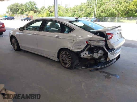 2016 Ford Fusion Titanium with VIN 3FA6P0K96GR390989, listed as a IAAI auction lot 42634275 with 123,559 mi miles and . Bid and sale history available at DreamBid. Image 3.