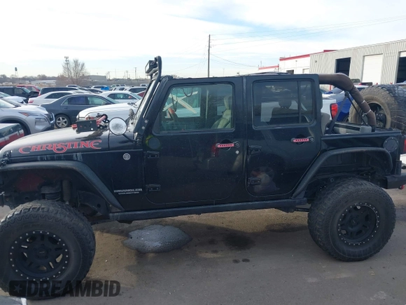 2009 Jeep Wrangler Unlimited Rubicon z VIN 1J4GA69159L749215, wystawiony jako IAAI lot #41489893 z przebiegiem 177 768 mil mil oraz . Historia ofert i sprzedaży dostępna na DreamBid. Obrazek 14.
