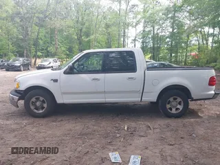 2003 Ford F-150 XLT with VIN 1FTRW07663KD69809, listed as a IAAI auction lot 42198549 with 166,466 mi miles and . Bid and sale history available at DreamBid. Image 14.