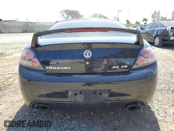 2008 Hyundai Tiburon GT z VIN KMHHN66F18U295838, wystawiony jako Copart lot #51972325 z przebiegiem 147 626 mil mil oraz Szkoda całkowita • Salvage title. Historia ofert i sprzedaży dostępna na DreamBid. Obrazek 6.