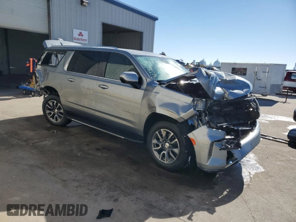 2024 Chevrolet Suburban LS with VIN 1GNSCBKD3RR252188, listed as a Copart auction lot 76882484 with 11,997 mi miles and Salvage Title. Bid and sale history available at DreamBid. Image 4.