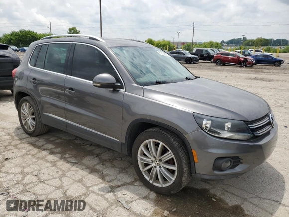 2012 Volkswagen Tiguan SE z VIN WVGAV7AX4CW001417, wystawiony jako Copart lot #61105865 z przebiegiem 168 110 mil mil oraz Czysty tytuł • Clean title. Historia ofert i sprzedaży dostępna na DreamBid. Obrazek 4.