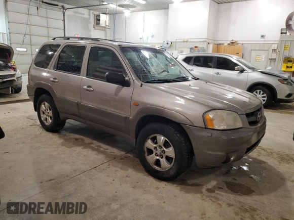2001 Mazda Tribute LX with VIN 4F2CU08101KM05943, listed as a Copart auction lot 84077694 with 137,937 mi miles and Salvage Title. Bid and sale history available at DreamBid. Image 4.