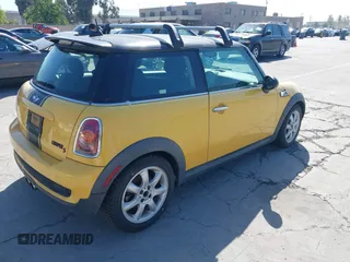 2008 MINI Hardtop S with VIN WMWMF73568TT90383, listed as a IAAI auction lot 42211410 with 98,055 mi miles and . Bid and sale history available at DreamBid. Image 4.