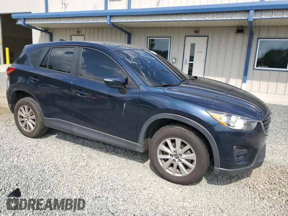 2016 Mazda CX-5 Sport z VIN JM3KE4BY8G0837052, wystawiony jako Copart lot #54700235 z przebiegiem 124 172 mil mil oraz Szkoda całkowita • Salvage title. Historia ofert i sprzedaży dostępna na DreamBid. Obrazek 4.
