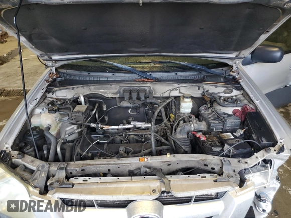 2006 Mazda Tribute i with VIN 4F2YZ02Z86KM02172, listed as a Copart auction lot 73214254 with 317,446 mi miles and Salvage Title. Bid and sale history available at DreamBid. Image 11.