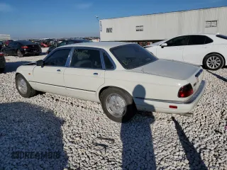 1995 Jaguar XJ with VIN SAJKX1745SC739290, listed as a Copart auction lot 82887524 with Not provided miles and Salvage title. Bid and sale history available at DreamBid. Image 2.
