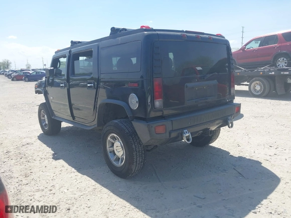 2005 Hummer H2 SUV with VIN 5GRGN23U25H128791, listed as a IAAI auction lot 42115436 with 286,818 mi miles. Bid and sale history available at carsss.com. Image 3.
