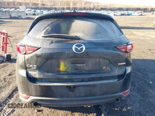 2021 Mazda CX-5 Touring with VIN JM3KFBCM2M1303063, listed as a IAAI auction lot 41814604 with 36,116 mi miles. Bid and sale history available at carsss.com. Image 16.