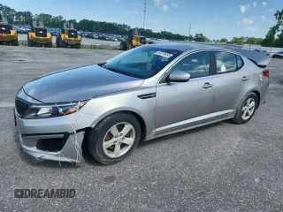 2015 Kia Optima LX z VIN KNAGM4A7XF5582090, wystawiony jako Copart lot #60319355 z przebiegiem 144 399 mil mil oraz Czysty tytuł • Clean title. Historia ofert i sprzedaży dostępna na DreamBid. Obrazek 1.