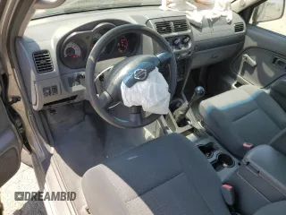 2004 Nissan Frontier XE with VIN 1N6DD26TX4C447116, listed as a Copart auction lot 59432335 with 127,001 mi miles and Salvage title. Bid and sale history available at DreamBid. Image 8.