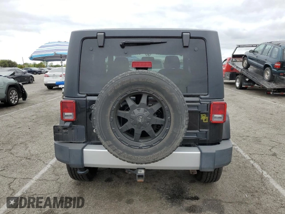2015 Jeep Wrangler Sahara z VIN 1C4AJWBG2FL614702, wystawiony jako Copart lot #53516315 z przebiegiem 91 899 mil mil oraz Szkoda całkowita • Salvage title. Historia ofert i sprzedaży dostępna na DreamBid. Obrazek 6.