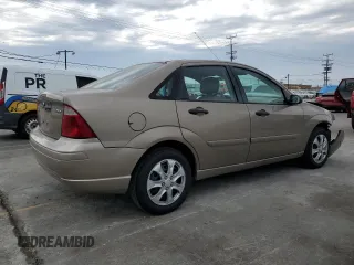 2005 Ford Focus S with VIN 1FAFP34N55W105530, listed as a Copart auction lot 59186695 with 136,204 mi miles and Salvage title. Bid and sale history available at DreamBid. Image 3.