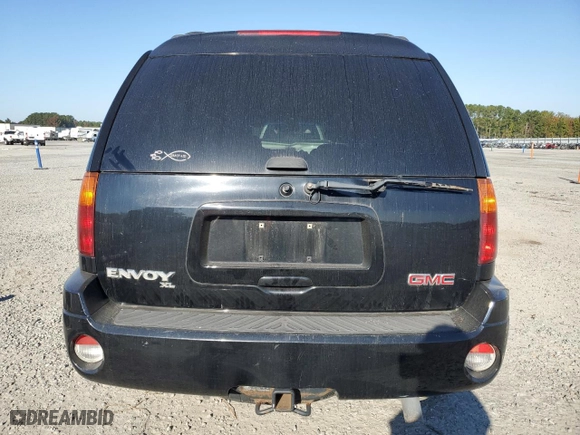 2005 GMC Envoy XL SLT with VIN 1GKET16S256109757, listed as a Copart auction lot 77220144 with 246,444 mi miles and Salvage Title. Bid and sale history available at carsss.com. Image 6.