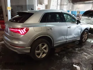 2019 Audi Q3 Premium with VIN WA1AECF33K1077204, listed as a IAAI auction lot 41538374 with 101,264 mi miles and . Bid and sale history available at DreamBid. Image 4.