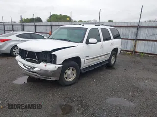 2003 GMC Yukon SLT with VIN 1GKEC13Z13J197955, listed as a IAAI auction lot 41953835 with 208,752 mi miles. Bid and sale history available at carsss.com. Image 2.