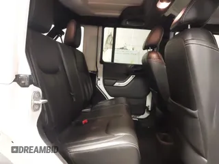 2014 Jeep Wrangler Unlimited Sahara with VIN 1C4BJWEG1EL326605, listed as a IAAI auction lot 41325037 with 135,824 mi miles. Bid and sale history available at carsss.com. Image 8.