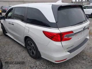 2020 Honda Odyssey Touring with VIN 5FNRL6H81LB028083, listed as a IAAI auction lot 42003810 with 71,536 mi miles and . Bid and sale history available at DreamBid. Image 3.
