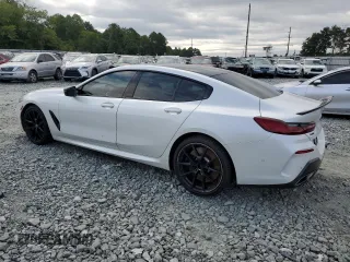 2020 BMW 8 Series M850i with VIN WBAGV8C02LCE26317, listed as a Copart auction lot 66147384 with 60,037 mi miles and Salvage Title. Bid and sale history available at carsss.com. Image 2.