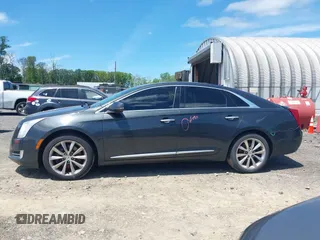 2013 Cadillac XTS Luxury z VIN 2G61R5S33D9101434, wystawiony jako IAAI lot #42290199 z przebiegiem 48 075 mil mil oraz . Historia ofert i sprzedaży dostępna na DreamBid. Obrazek 14.