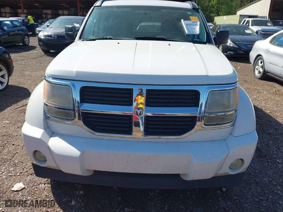 2009 Dodge Nitro SE with VIN 1D8GT28K19W518279, listed as a IAAI auction lot 41855238 with 186,607 mi miles. Bid and sale history available at carsss.com. Image 6.