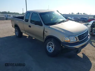 2000 Ford F-150 XL z VIN 1FTRX18W7YNA73804, wystawiony jako IAAI lot #42779753 z przebiegiem 228 666 mil mil oraz . Historia ofert i sprzedaży dostępna na DreamBid. Obrazek 1.
