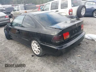 1997 Honda Civic DX with VIN 1HGEJ6125VL095006, listed as a IAAI auction lot 41473812 with 264,966 mi miles. Bid and sale history available at carsss.com. Image 3.